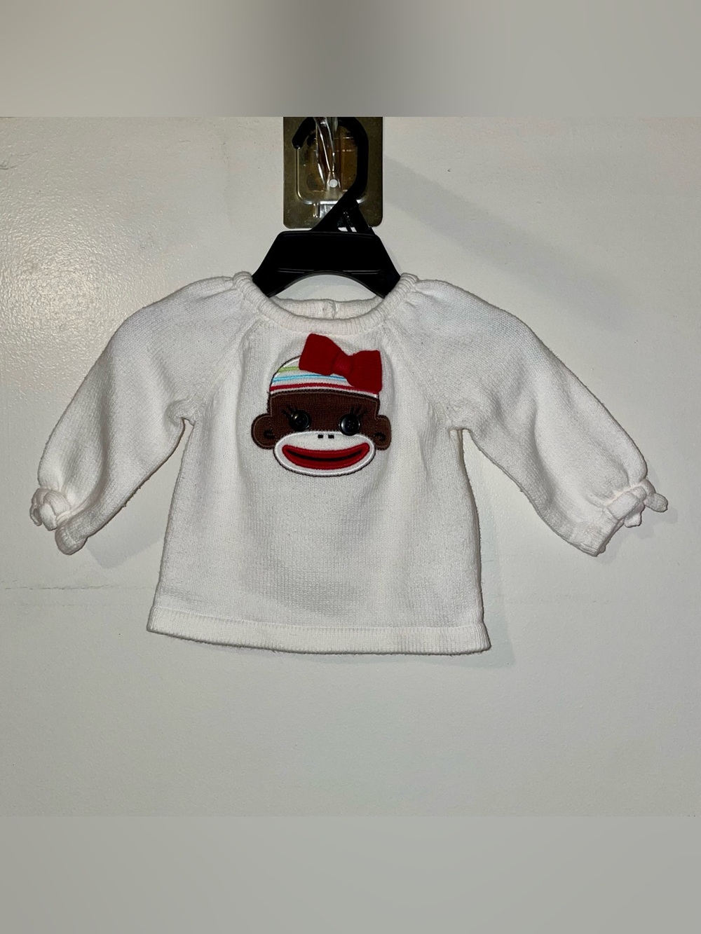 White Baby Sweatshirt with Sock Monkey Patch and Red Bow
